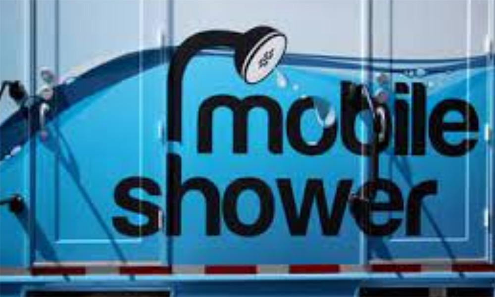 The mobile shower sign on the side of the mobile shower unit.